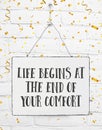 Positive motivation quote life begins at the end of your comfort Royalty Free Stock Photo