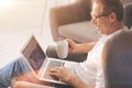 Positive nice man looking at the laptop screen Royalty Free Stock Photo