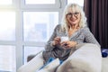 Positive nice woman holding a cup of tea Royalty Free Stock Photo