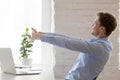 Worker doing effective stretching exercises during the working day