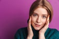 Positive optimistic young woman posing isolated