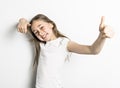 Positive Portrait of cute, confident 9 years old girl, isolated on white Royalty Free Stock Photo