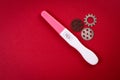 Positive pregnancy test and gears. Women 's health concept Royalty Free Stock Photo