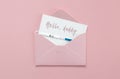 Positive pregnancy test in pink envelope on pink background, postcard with inscription hello, daddy, pregnancy concept