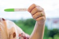 Positive pregnancy test on strip. baby coming soon concept.