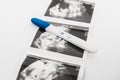 Positive pregnancy test on ultrasound photo. A positive pregnancy test result. Pregnancy test showing a positive result.