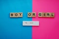 Positive pregnancy test and the words Boy or girl on a multi-colored background. Motherhood, children, pregnancy, the Royalty Free Stock Photo