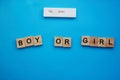 positive pregnancy test and the words Girl or boy on a blue background. Motherhood, children, pregnancy, concept of Royalty Free Stock Photo