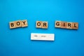 positive pregnancy test and the words Girl or boy on a blue background. Motherhood, children, pregnancy, concept of Royalty Free Stock Photo