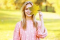 Positive pretty woman having fun in sunny autumn park Royalty Free Stock Photo