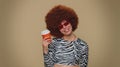 Positive pretty woman drinking coffee from cup, enjoying hot beverage in papercup, holding espresso