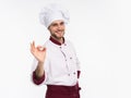 Positive professional happy man chef showing tasty ok sign isolated on white background. Royalty Free Stock Photo