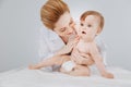 Positive qualified pediatrician enjoying her work with adorable patient Royalty Free Stock Photo