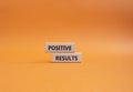 Positive results symbol. Concept words Positive results on wooden blocks. Beautiful orange background. Business and Positive Royalty Free Stock Photo