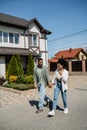 positive romantic african american couple walking