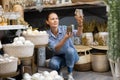 Woman selecting decorative candles in christmastime Royalty Free Stock Photo