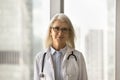 Positive senior medical therapist woman in glasses head shot portrait Royalty Free Stock Photo