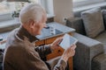 Positive Senior using Digital Tablet Royalty Free Stock Photo