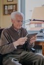 Positive Senior using Digital Tablet Royalty Free Stock Photo