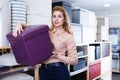 shop assistant suggesting new hassock