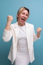 positive slim young caucasian blond lady in white jacket and dress shares ideas Royalty Free Stock Photo