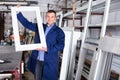 Professional labour with finished PVC profiles and windows at factory Royalty Free Stock Photo