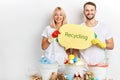 Positive smiling young man and woman advising people to recycle waste, rubbish Royalty Free Stock Photo