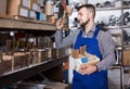 worker checking small details for sanitary engineering in workshop Royalty Free Stock Photo