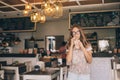 Teen girl drinking smoothie in cafe Royalty Free Stock Photo