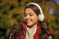 positive teen girl listening music wearing headphones. photo of teen girl listening music. Royalty Free Stock Photo