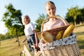 Positive teenager girl holding a basket for a picnic Royalty Free Stock Photo