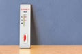 Positive Tests COVID-19 coronavirus, rapid test cassette on the wooden table. 3D rendering Royalty Free Stock Photo