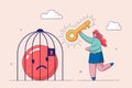 Positive thinking concept. Bad mood and negative emotions closed in cage. Woman lock negative emoji in birdcage, good
