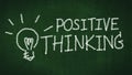 Positive thinking concept. handwritten word positive thinking on black chalkboard with light bulb as idea Royalty Free Stock Photo