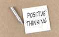POSITIVE THINKING text on sticky note on a cork board with pencil Royalty Free Stock Photo