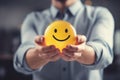 Positive Vibes: Man Holding a Yellow Smiley, Good Feedback, review