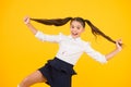 Positive vibes. School life concept. Celebrate knowledge day. Student little kid. Girl pupil on yellow background. Back