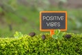 Positive vibes text on small blackboard