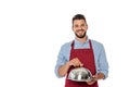 Positive waiter in apron holding dish cover and tray