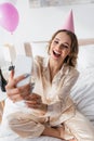 Positive woman with champagne and party