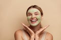 Positive Woman with Face Mask. Spa Face Mask. Skin Care Beauty Treatment Royalty Free Stock Photo