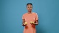 Positive woman juggling with fresh lemons and smiling