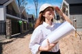 Positive woman landscape designer coming to construction site to examine it