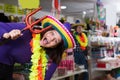 woman is trying things in store of festival outfits Royalty Free Stock Photo