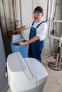 Workman installing a household water softener