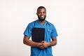 Positive young black doctor with patients anamnesis over white Royalty Free Stock Photo