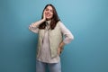 positive young brunette lady friendly posing and smiling