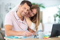 positive young couple calculating bills at home Royalty Free Stock Photo