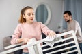 Young couple cleaning table in living room Royalty Free Stock Photo