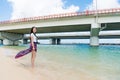 Slim girl standing aside Naminoue Beach. Royalty Free Stock Photo